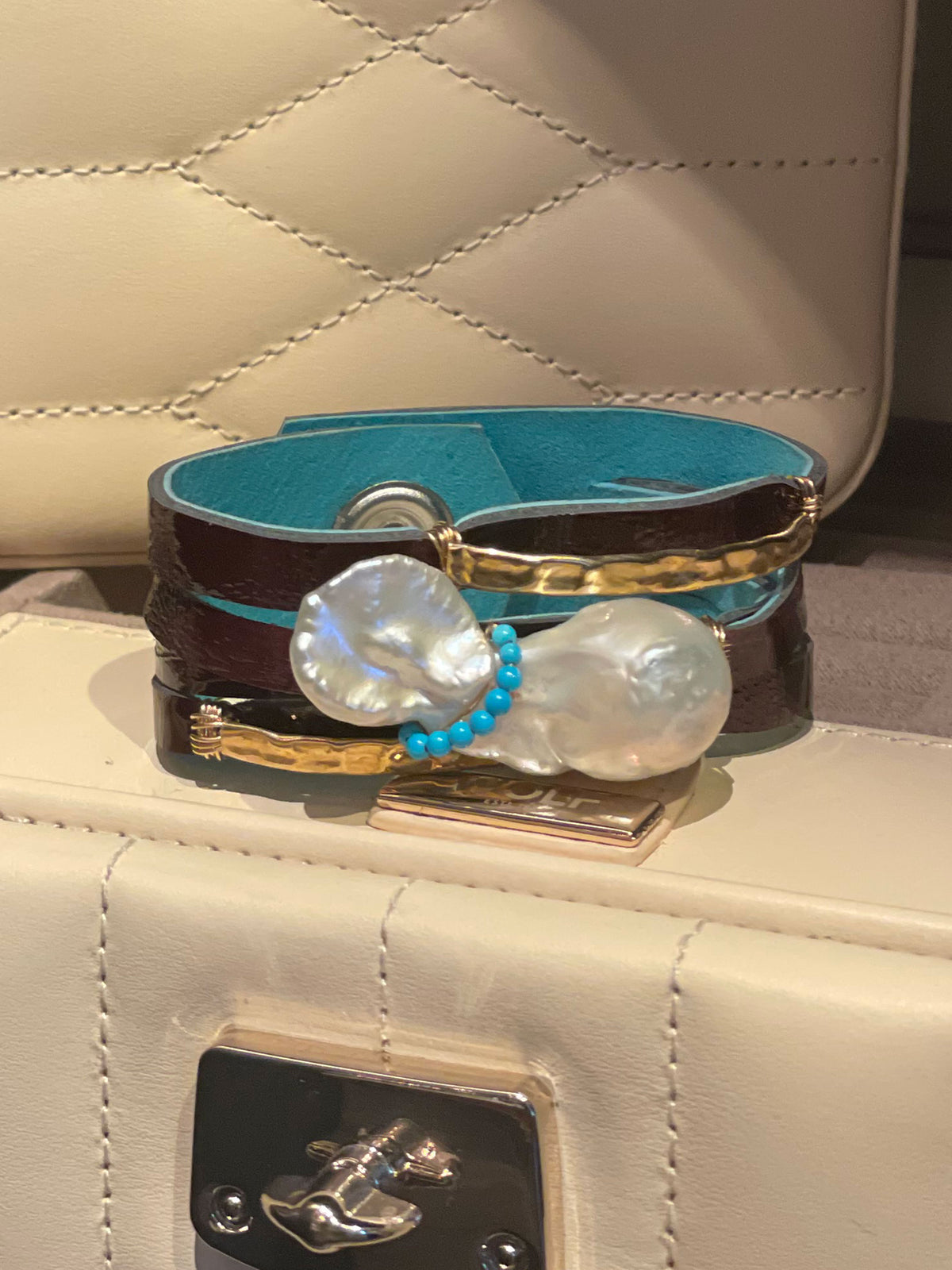 CARMELA PATENT BROWN LEATHER WITH WHITE BAROQUE PEARL WRAPPED IN TURQUOISE