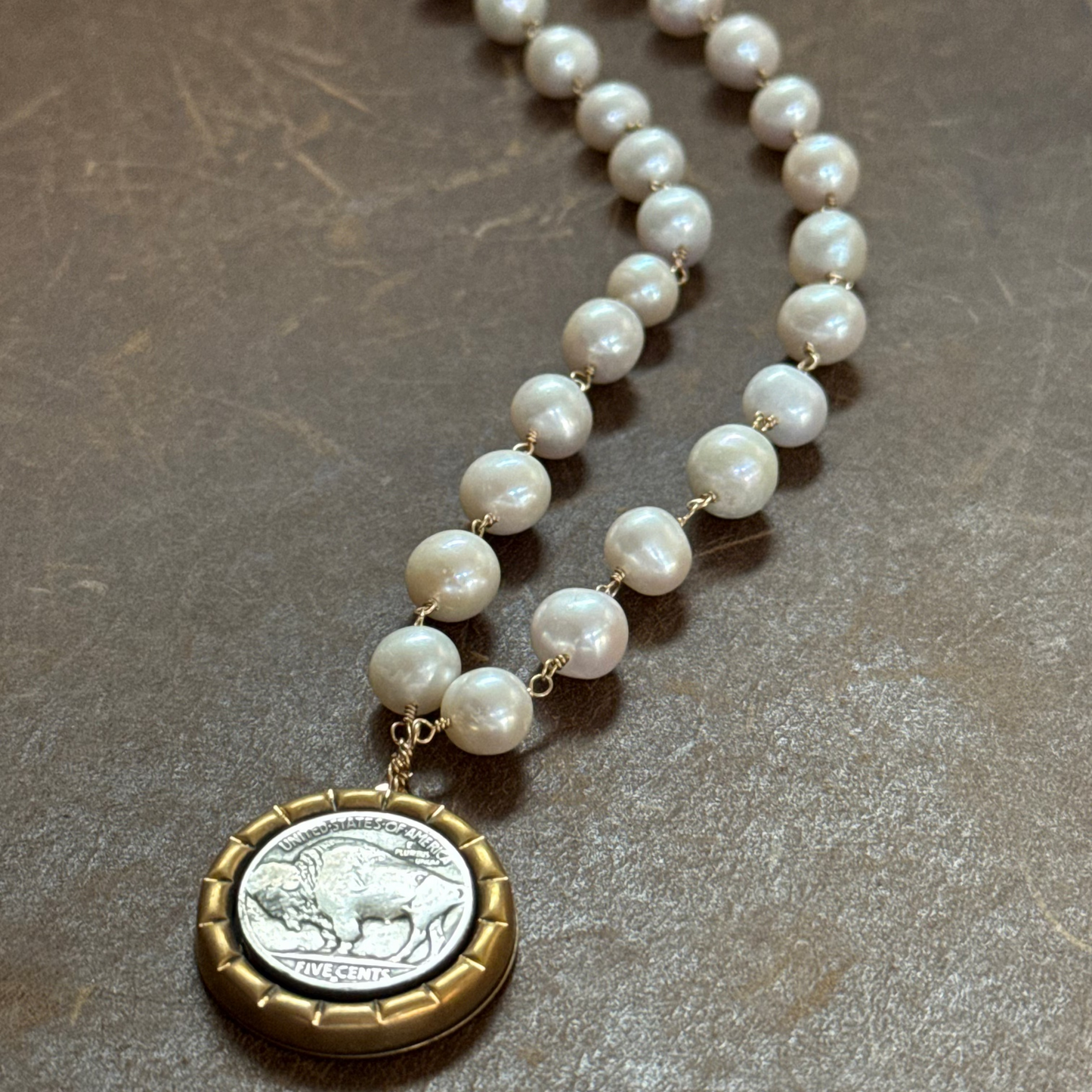Buffalo nickel with white round cultured pearls